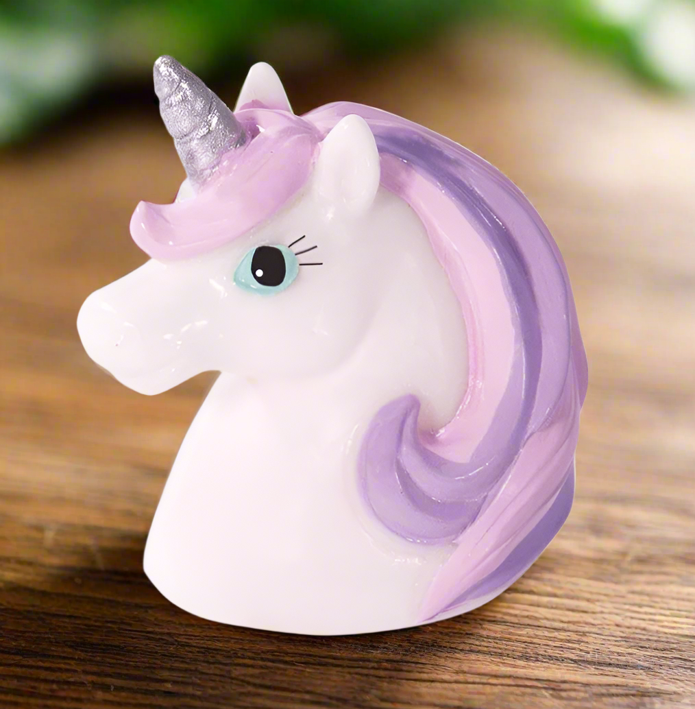Unicorn-shaped object with purple mane and horn on a white background
